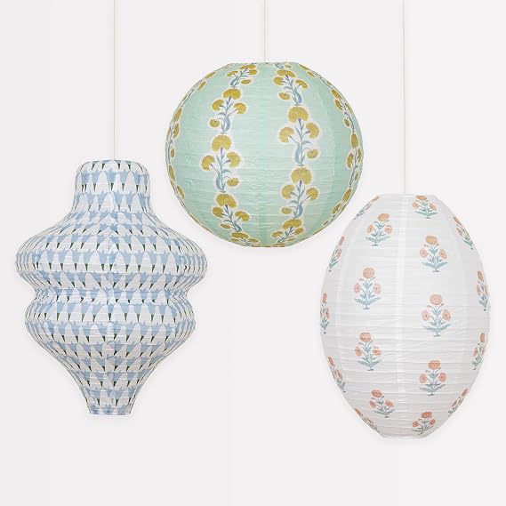 Three printed pastel paper lanterns in block-print patterns