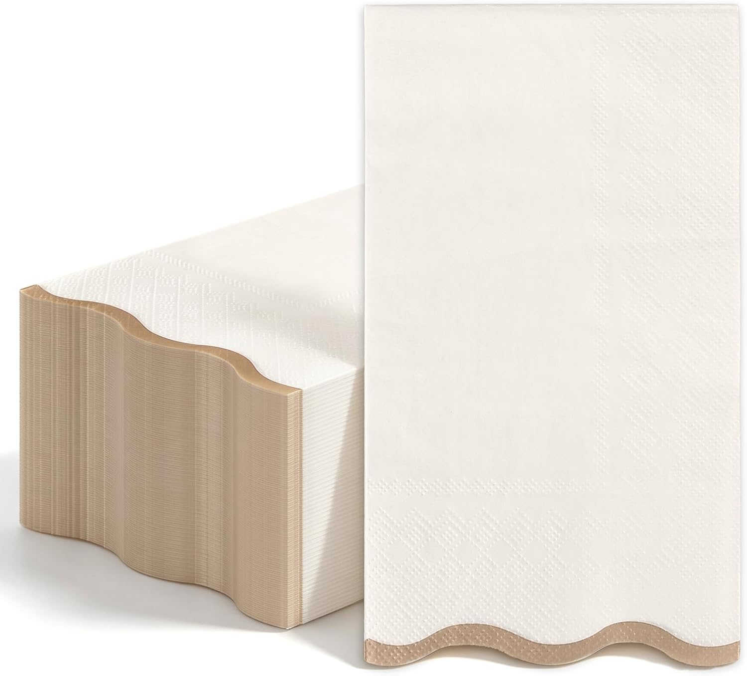 Scalloped ivory paper guest napkins stacked on a table